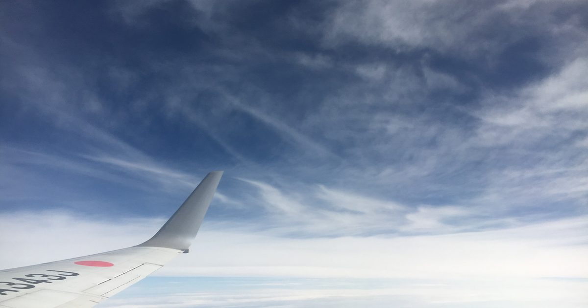 View from an aeroplane window above the clouds